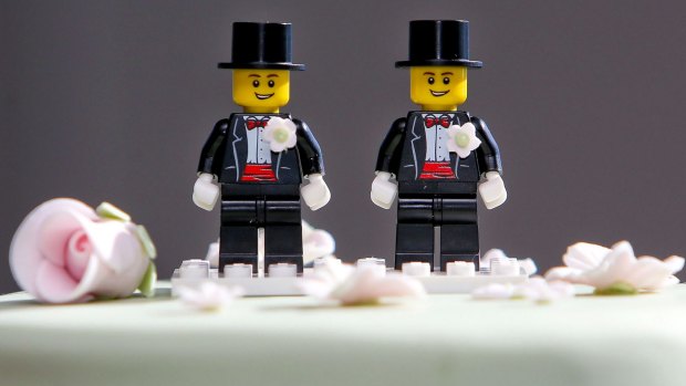 Two Lego men decorate the top of Paul McCarthy and Trent Kandler's wedding cake. The Australian couple was flown to Wellington by Tourism New Zealand in a promotion to highlight to Australians that same-sex marriage is legal in New Zealand. 