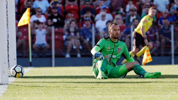 Tough day: Jets goalkeeper Jack Duncan sits in front of goal after failing to save a shot from Roy Krishna.