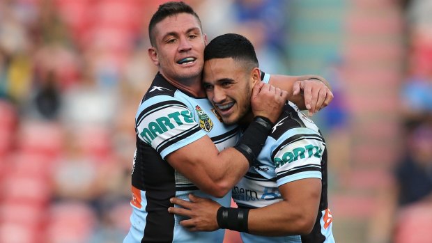 Four try hero: Valentine Holmes, right, celebrates with Chris Heighington.