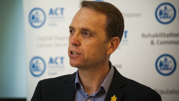 Capital Metro Minister Simon Corbell says the Liberals' promise to scrap the contract as "reckless and lunatic".