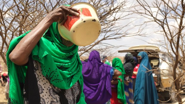 Drinking water at the Somali Red Crescent mobile clinic at Wacays Dhukur.