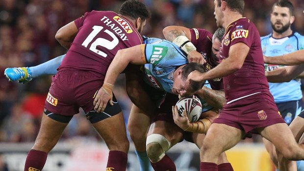 Dangerous tackle: Paul Gallen is tackled by Sam Thaiday.