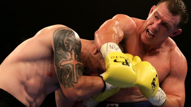 Paul Gallen throws a right at Randall Rayment.
