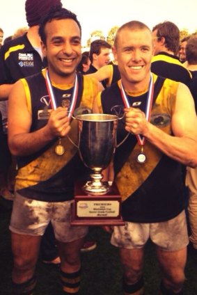 Harmit Singh and Tarkyn Lockyer celebrate after winning the Gippsland league premiership with Morwell in 2013.
