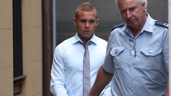 One-punch killer Kieran Loveridge is escorted from the NSW Supreme Court in November 2013.