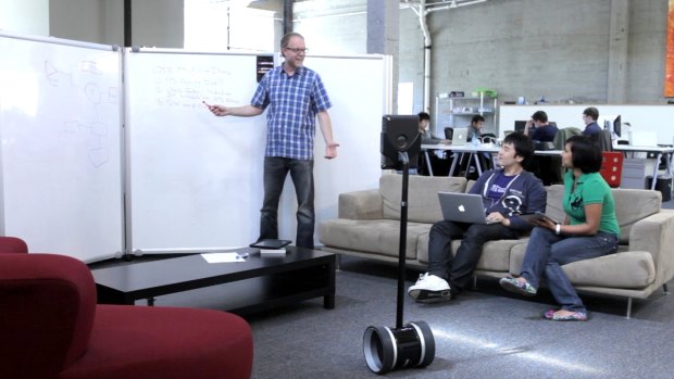 Near future: A telecommute robot from Double Robotics attends a meeting.