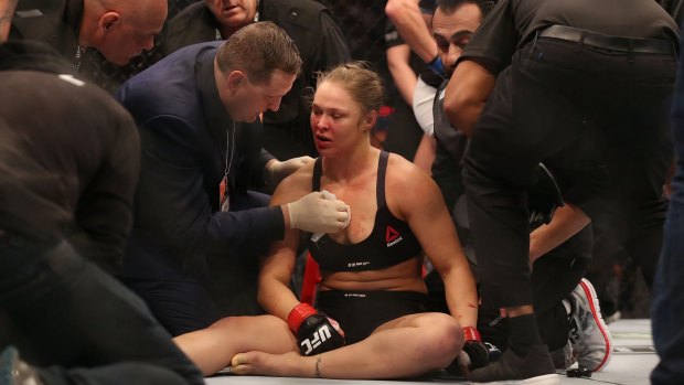Ronda Rousey receives medical treatment after her loss.