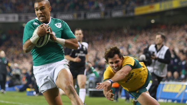On a roll: Ireland winger Simon Zebo swoops on a kick to score the opening try against the Wallabies in November.