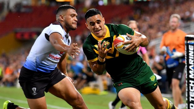 Bound for the wing?: Valentine Holmes scores one of his six tries against an outclassed Fiji.