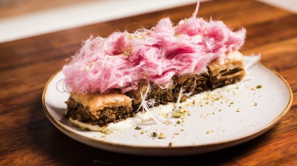 Baklava topped with a toupee of pink fairy floss.