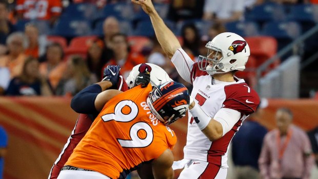 Cardinals quarterback Blaine Gabbert throws under pressure from Adam Gotsis.