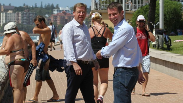 Premier Mike Baird, right, and Deputy Premier, Troy Grant, at Queenscliff beach on Sunday.