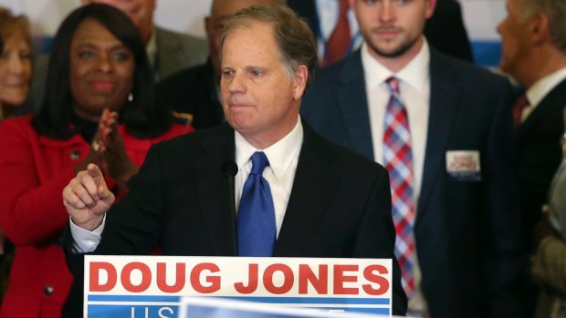 Democrat Doug Jones speaks in Birmingham, Alabama after a stunning victory against former justice Roy Moore. 