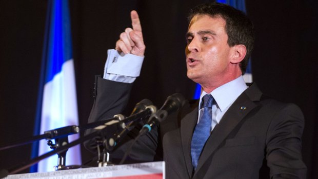 Lights out: French Prime Minister Manuel Valls gestures as he speaks during a meeting in Audincourt.
