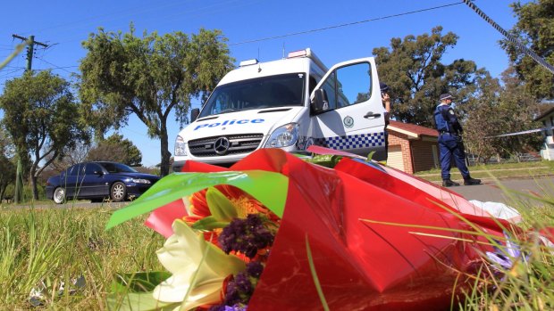 Floral tributes at the scene of the Lalor Park murders.