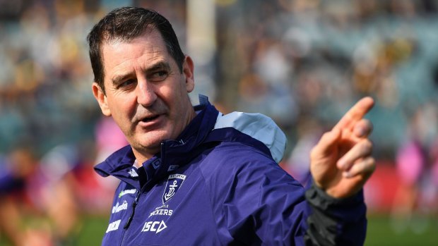 Trial by fire: Ross Lyon left young defender Sam Collins on key Eagle forward Josh Kennedy to provide a 'learning' experience.