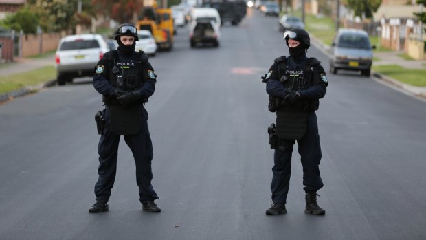 Police conduct a raid in Lockwood Street, Merrylands.