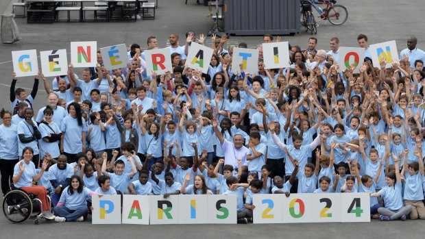 Primary and secondary school students celebrate Paris' bid for the 2024 Summer Olympics. 