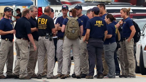 The FBI officers gather to continue their investigation at the Pulse nightclub.