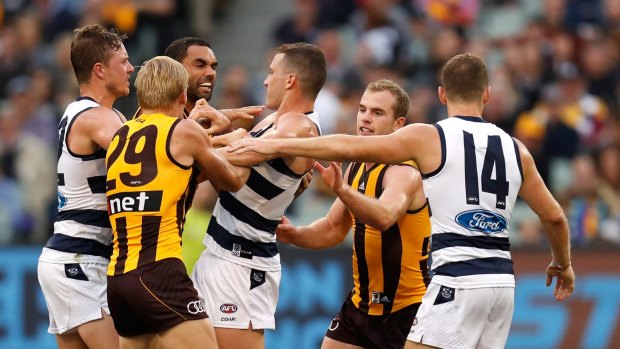 Hawks players remonstrate with Sam Menegola after his dangerous tackle on Luke Hodge.