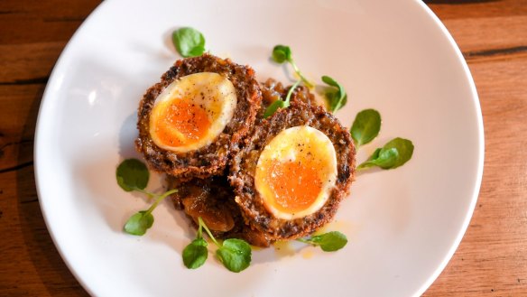 Scotch eggs encased in sausage and black pudding.