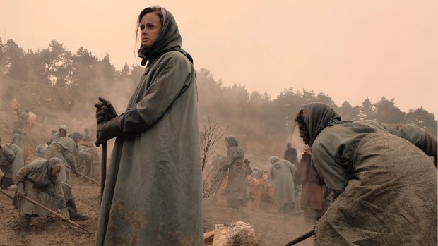 Ofglen/Emily (Alexis Bledel) ponders the short and brutal life of a worker in the Colonies.