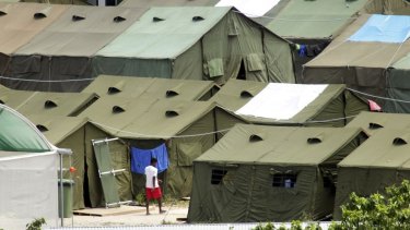A refugee wanders through the tents at the Nauru detention centre.