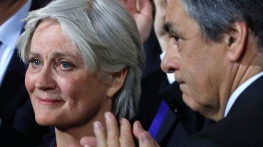 Penelope Fillon, wife of conservative presidential candidate Francois Fillon, right, reacts during a campaign meeting in Paris, on Sunday.