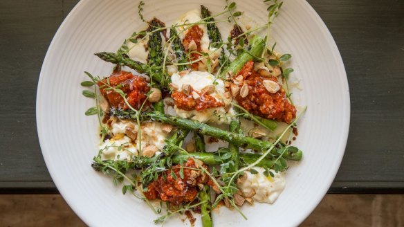 Stracciatella and grilled asparagus with romesco sauce at Union Dining.