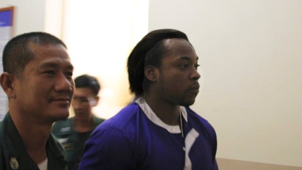 Nigerian Precious Chineme Nwoko, right, at the Cambodian Appeals Court on Tuesday after being refused permission to appeal against his 27-year prison sentence for heroin smuggling.