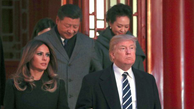 US President Donald Trump and first lady Melania Trump arrive with Chinese President Xi Jinping, left back, and Xi's wife Peng Liyuan, right back, for an opera performance at the Forbidden City.