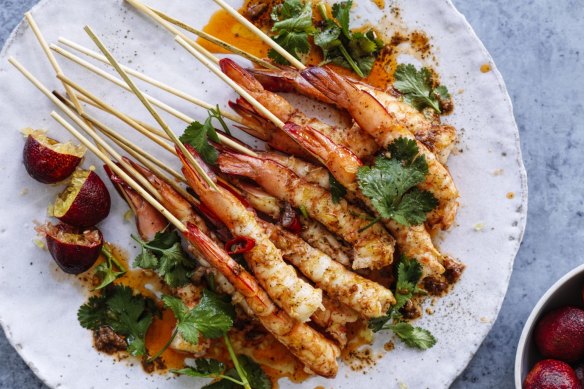 Prawn skewers with lemon myrtle butter and blood limes (right).