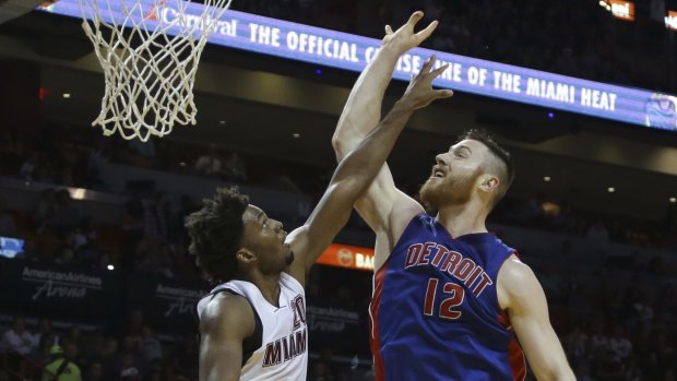 Optimistic for Rio: Aron Baynes goes up against Miami Heat's Justise Winslow last week .