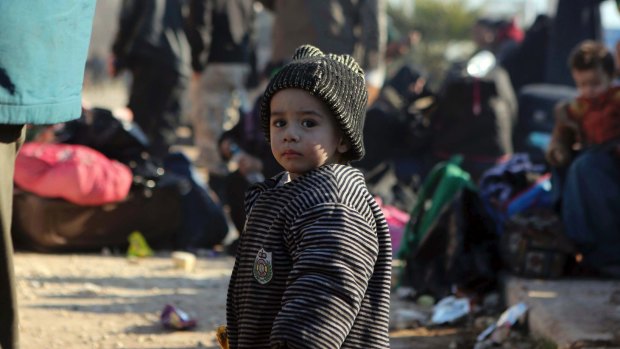 A Syrian child evacuated from Aleppo arrives at a refugee camp in Rashidin, near Idlib, Syria.
