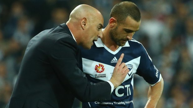 Victory coach Kevin Muscat speaks to Carl Valeri.