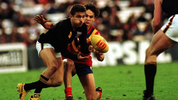 A distant memory: South Australian star Gavin Wanganeen tries to get the ball from a West Australian opponent during a State of Origin match in Adelaide in 1998.