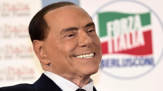 Silvio Berlusconi's face resembled a frozen robot's when he appeared on an Italian talk show to promote his new political party.