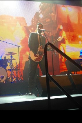Waleed Aly playing Pink Floyd's song 'Comfortably Numb' on stage at the Walkley Awards on Thursday night.