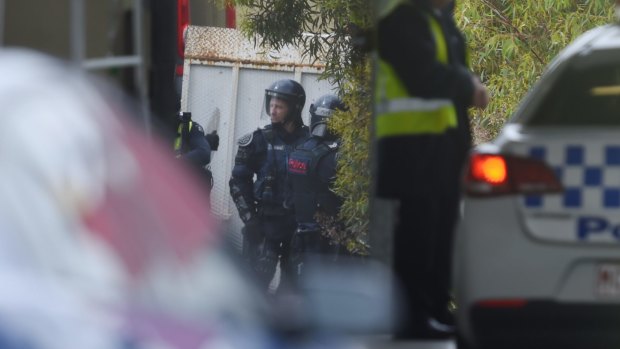 Police in riot gear outside the Parkville Youth Justice Centre on Monday.