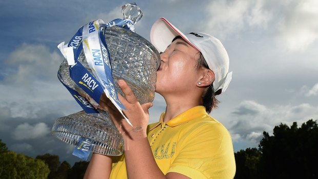 Special win: Jiyai Shin of South Korea holds the trophy at Royal Pines.