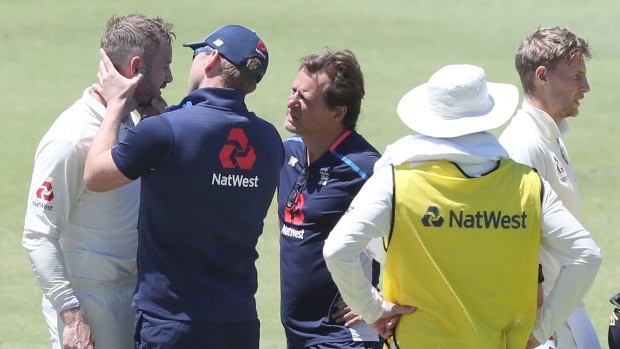 Ashes cauldron: Mark Stoneman receives medical treatment after being hit on the head from a delivery by Josh Hazlewood on day one of the third Test.