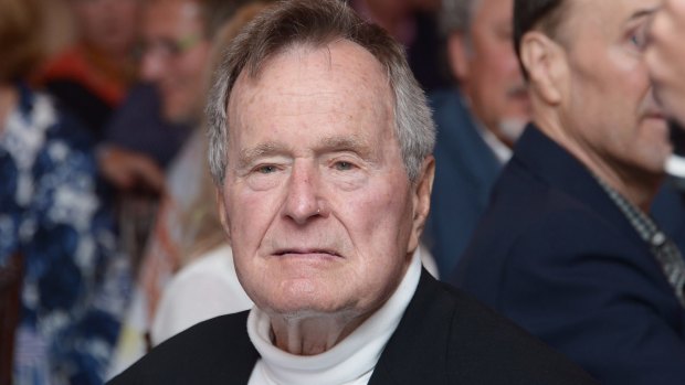 Former US president George H.W. Bush is critical of some aspects of his son's presidency in a forthcoming book.