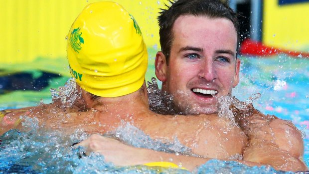 James Magnussen embraces Cameron McEvoy after winning the 100m freestyle.