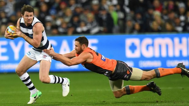 Elusive: Patrick Dangerfield gets away from the Giants defence..