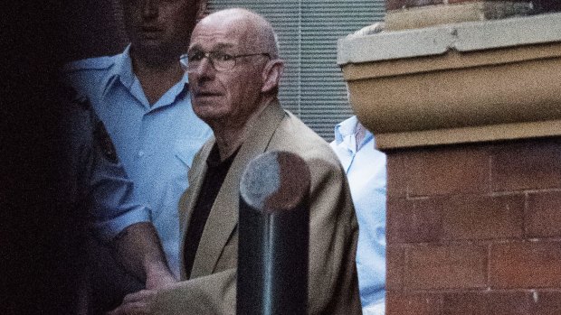  Roger Rogerson is led away from the Supreme Court on April 27.