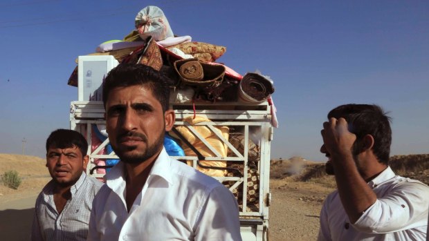 Displaced Iraqis return to their liberated villages outside Mosul.
