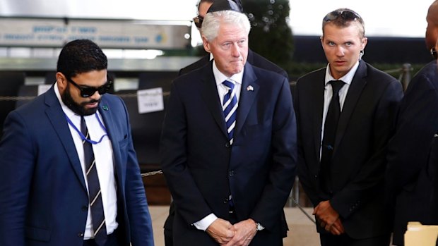 Former US president Bill Clinton, centre, arrives for the funeral of former Israeli president Shimon Peres in Jerusalem.