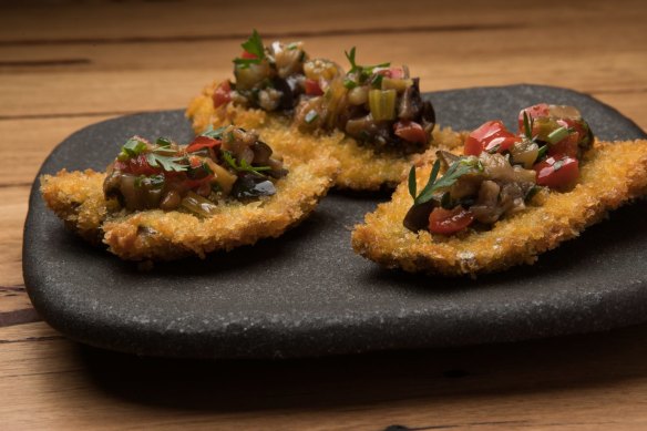 Crumbed butterflied sardines with eggplant caponata.