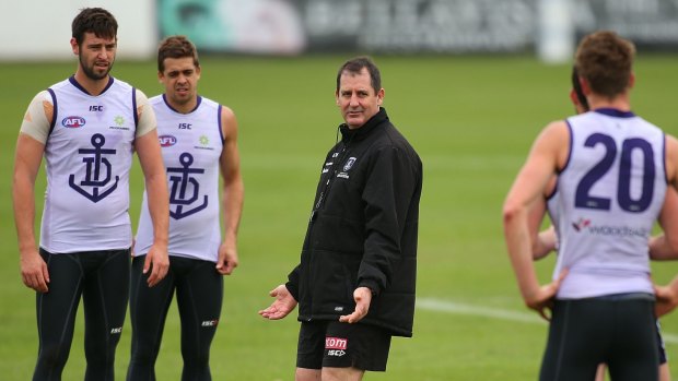 Ross Lyon puts Fremantle players through their paces.