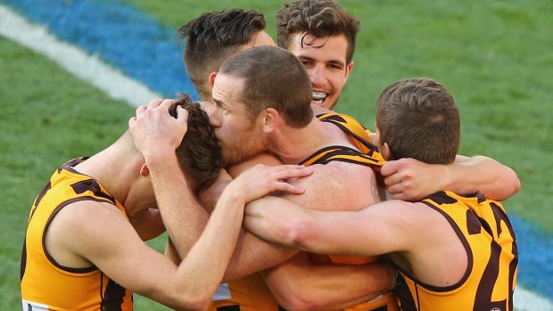 Hawthorn players celebrate 2014 premiership.